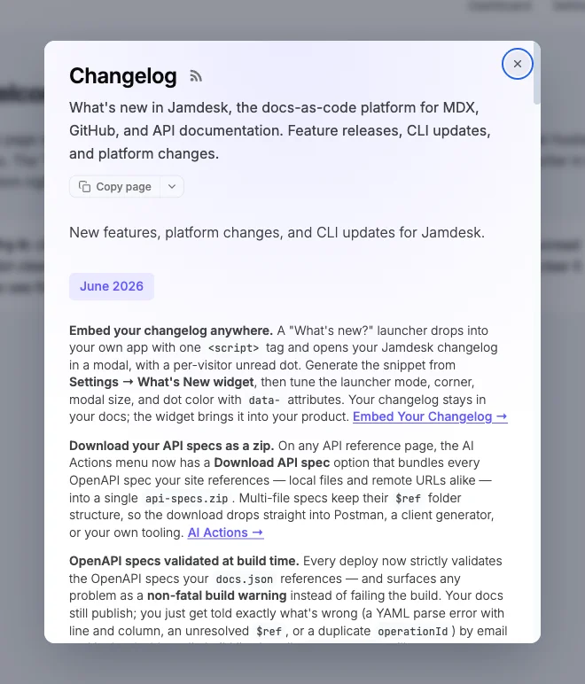 La ventana modal «What's new» abierta sobre una aplicación atenuada, mostrando la página de changelog de Jamdesk con un botón Copy page, entradas con fecha y un botón de cierre en la esquina